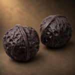 Lifelike handmade Yixing zisha walnut tea pet pair set with natural clay texture. Ideal gongfu tea table ornament & collectible oriental craft gift for tea lovers.